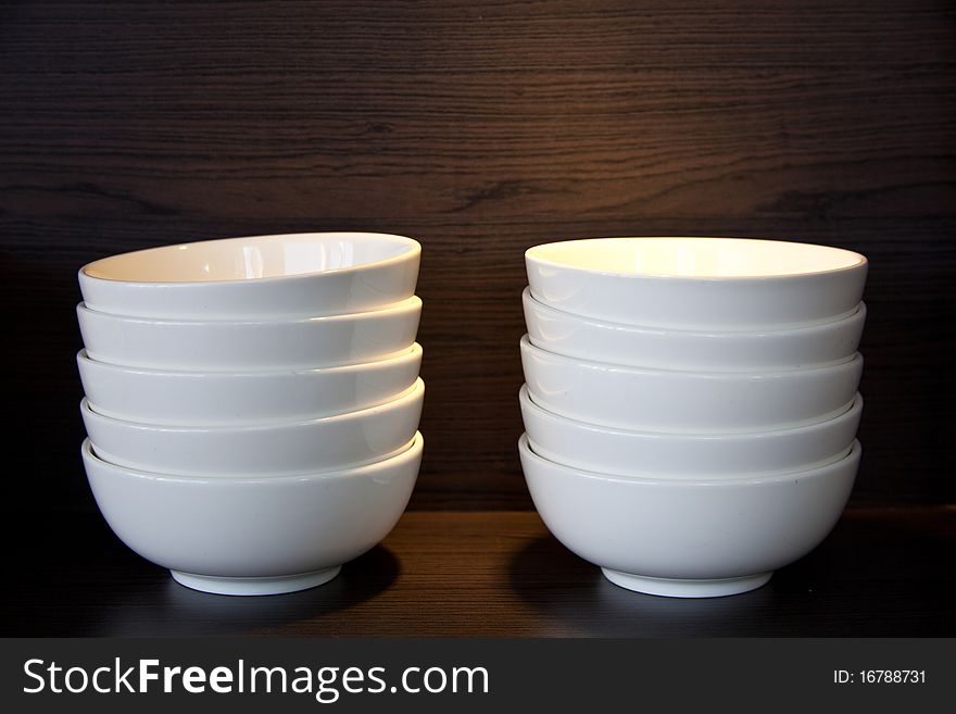 White bowls stacking on the shelve. White bowls stacking on the shelve