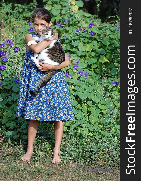 Girl with her cat outdoor. Near Kiev,Ukraine