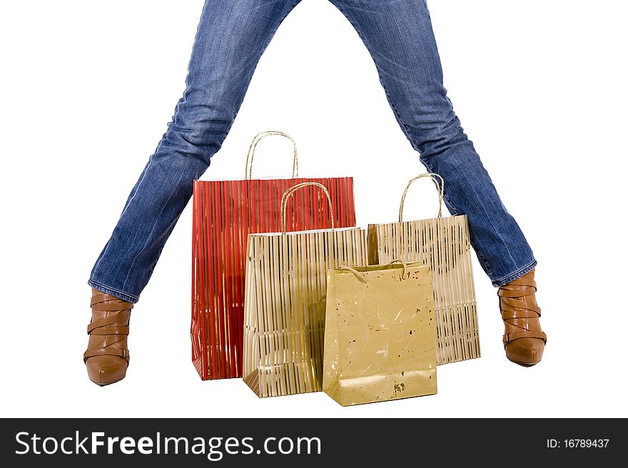 blond woman with shopping bags smiling happily. blond woman with shopping bags smiling happily
