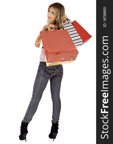 blond woman with shopping bags smiling happily. blond woman with shopping bags smiling happily