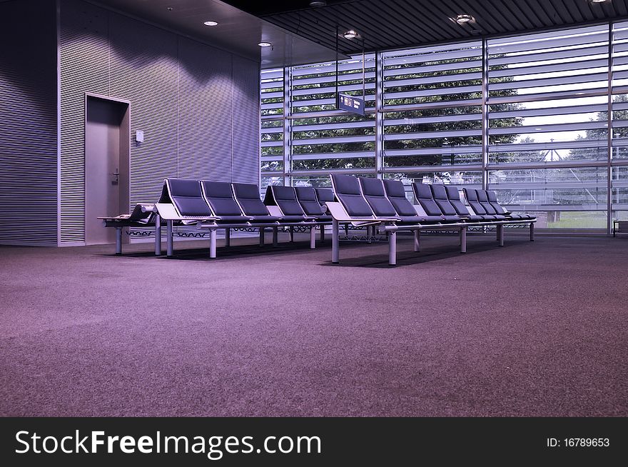 Modern waiting hall with seats row and electrical illumination