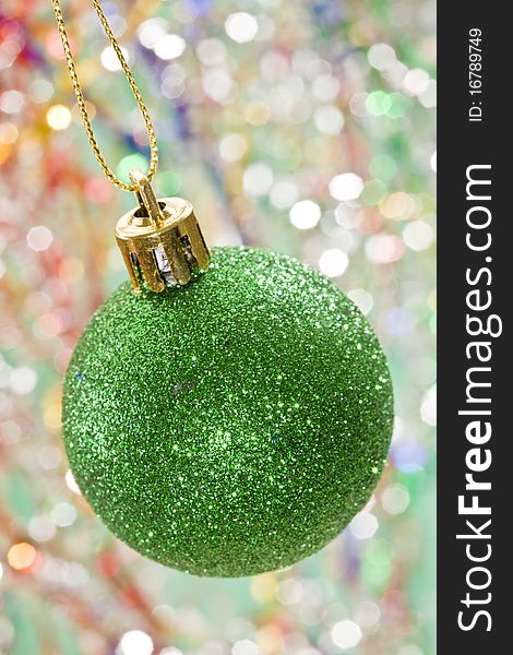 Holiday series: christmas green ball decoration on decorated  background. Holiday series: christmas green ball decoration on decorated  background