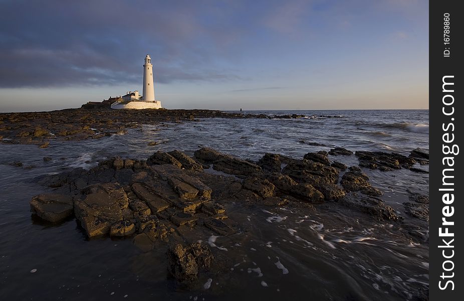 St mary's lighthouse at sunrise with blue sky