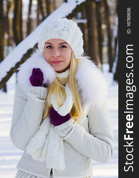 Portrait of beautiful adult girl outdoor in winter