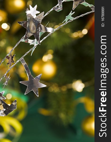 Holiday series: christmas star shaped decoration on decorated fir background. Holiday series: christmas star shaped decoration on decorated fir background