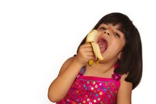 Girl Eating Banana Royalty Free Stock Images