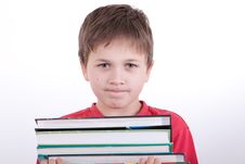 The Boy Holds A Pile Of Books Stock Images The Boy Holds A Pile Of Books Stock Images