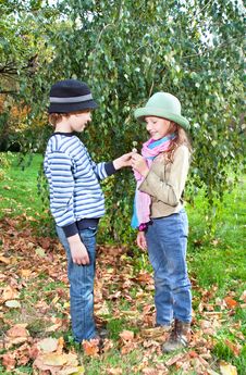 Happy Girl And Boy Enjoying Golden Autumn Royalty Free Stock Images Happy Girl And Boy Enjoying Golden Autumn Royalty Free Stock Images