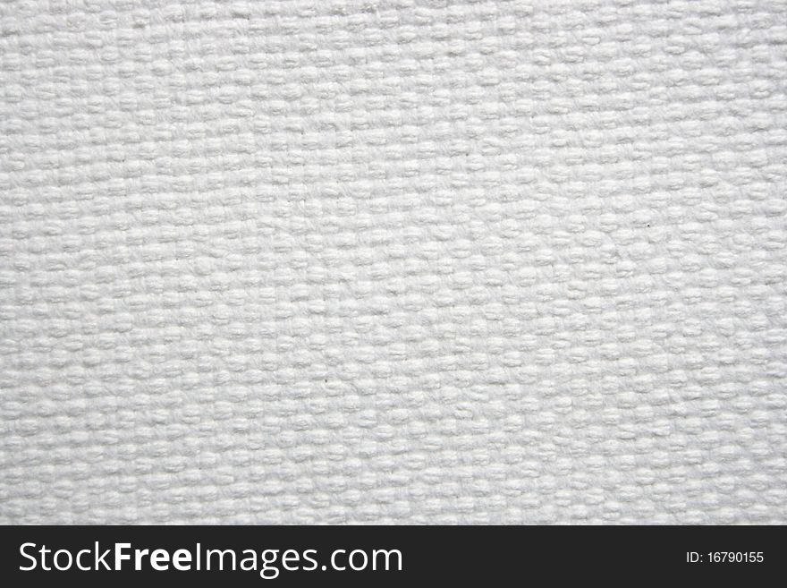 A thick canvas. White color. Very useful for background usage and textural usages.