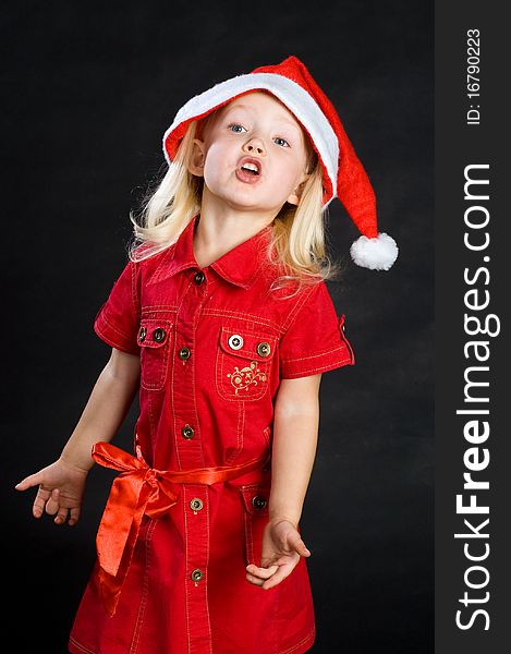 Shouting girl in red dress and santa hat