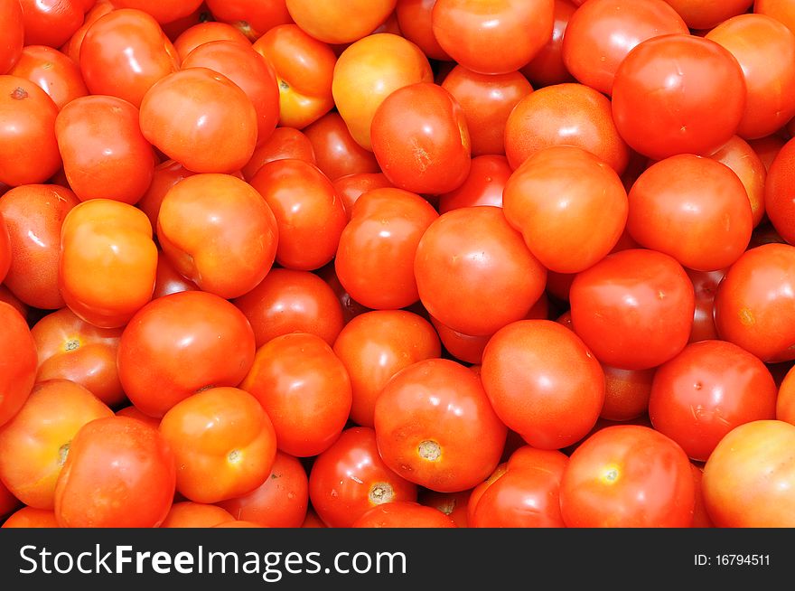 A Background Of Ripe Tomatoes At A Market Stall