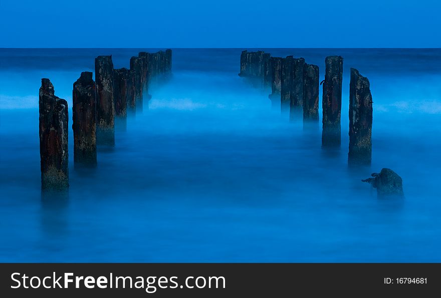 A ruined Pier  at night