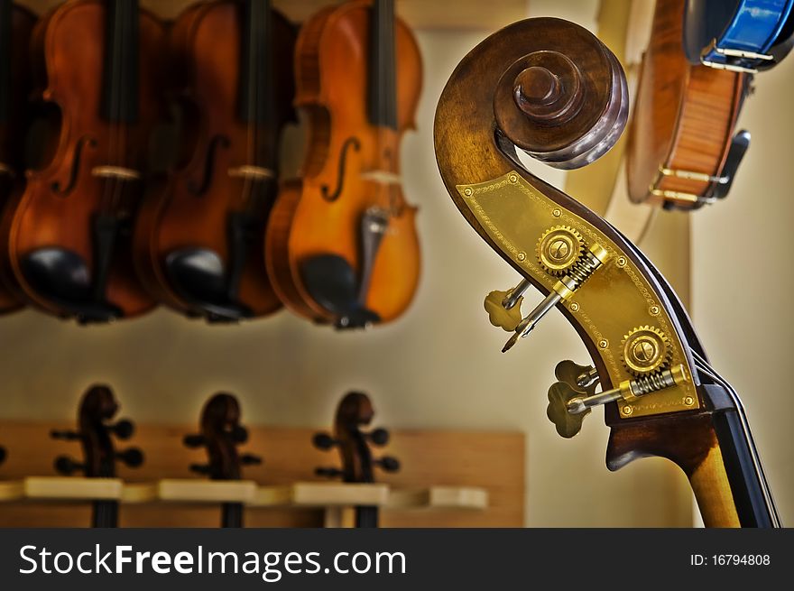 Close up of a cello with viola background