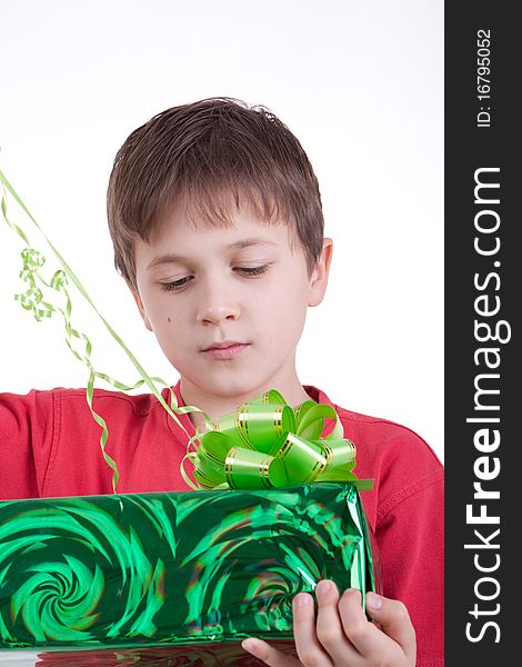 The boy has received a gift, Holds a box with a gift