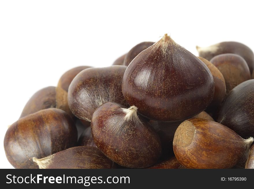 Heap of chestnuts fragment isolated over white background. Heap of chestnuts fragment isolated over white background