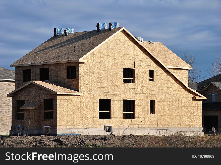 New home under construction in a subdivision. New home under construction in a subdivision