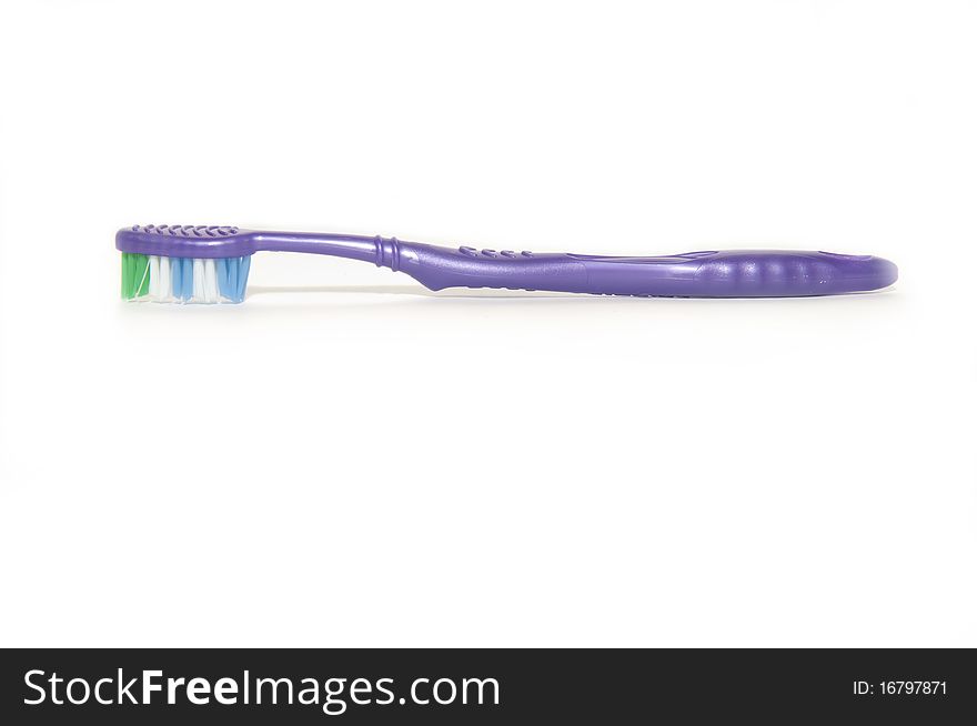 Purple tooth brush on white background