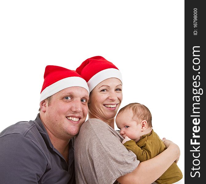 Young happy family with a baby girl getting ready for chirstmas. Young happy family with a baby girl getting ready for chirstmas.