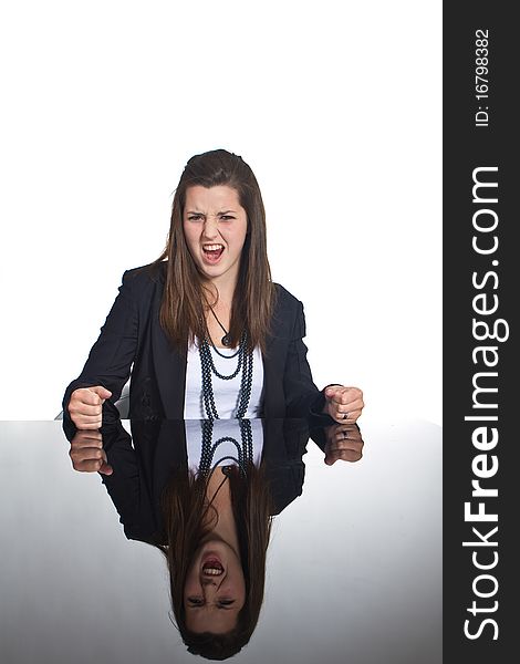 Young business teenage girl sitting at a mirror table. Young business teenage girl sitting at a mirror table.