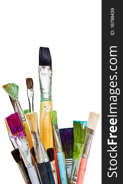 Old and used colorful paintbrushes isolated on white