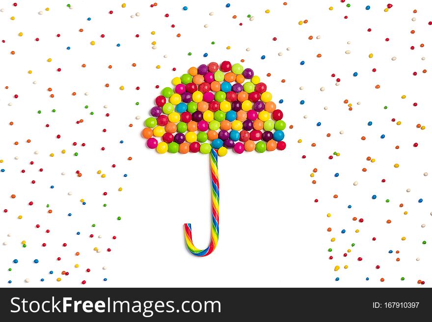 Umbrella, rain of mix colorful chocolate candy isolated on white background Holiday card Creative, Happy birthday party, minimal c