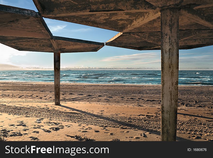 Concrete tent on a background of winter beach. Concrete tent on a background of winter beach