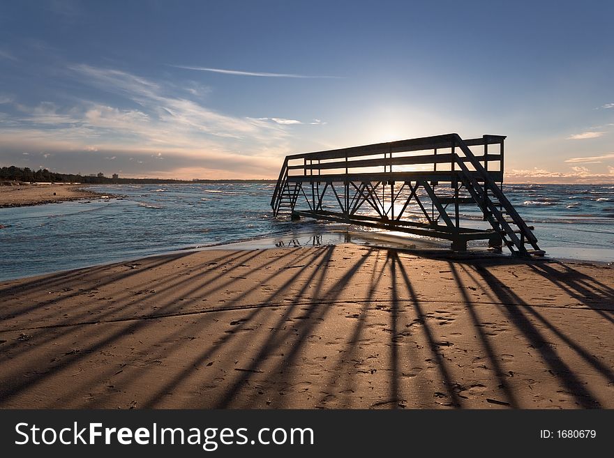 Silhouette of little bridge on a background of a sunset. Silhouette of little bridge on a background of a sunset