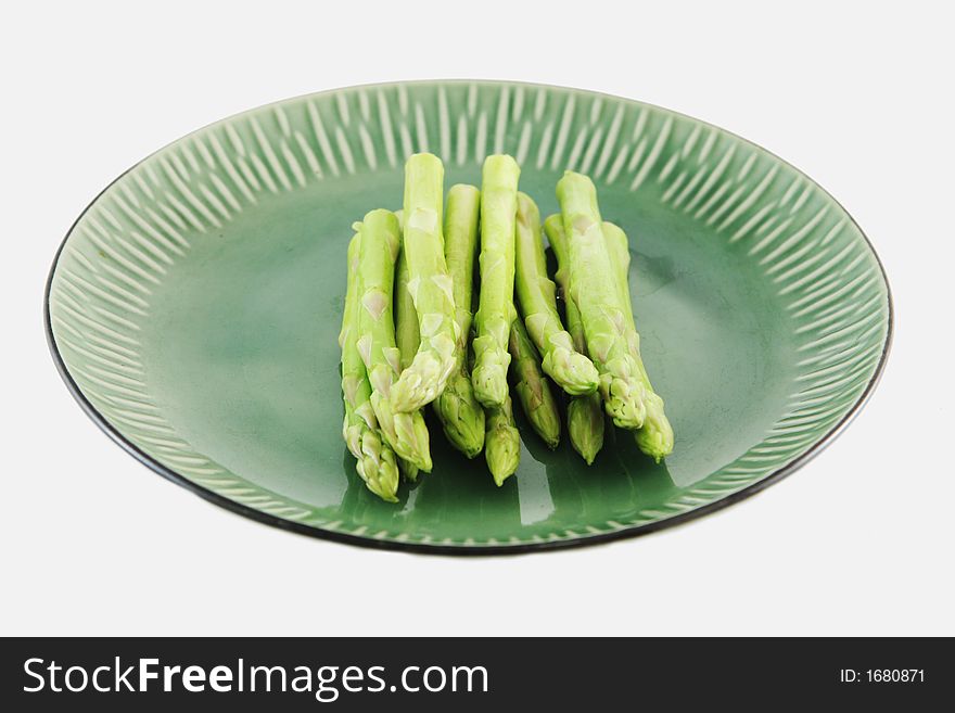 Fresh asparagus shoots on a plate