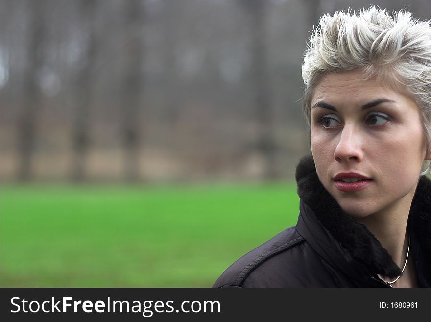 Portrait of a business woman outdoor in a park with various expressions. Portrait of a business woman outdoor in a park with various expressions