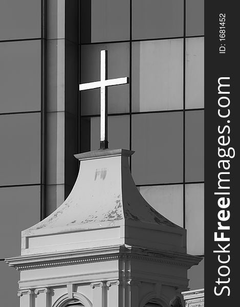 Cross of church before modern office building. Cross of church before modern office building