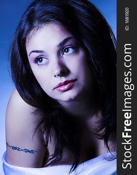 Portrait of Fresh and Beautiful brunette woman with tattoo