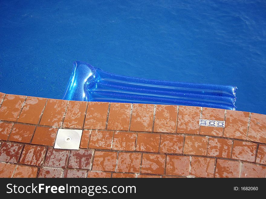 Coloured inflatable on a swimming pool. Coloured inflatable on a swimming pool