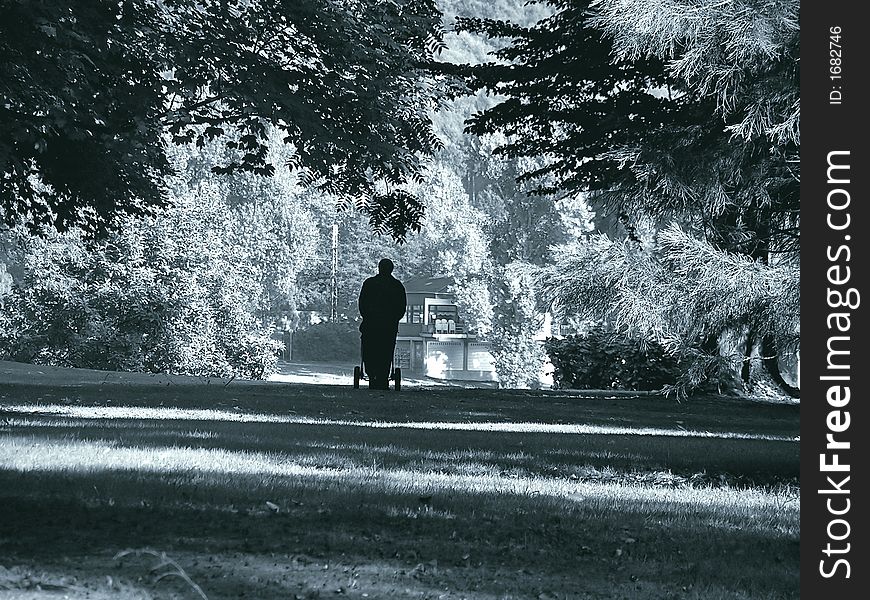 Shape of a man with a buggy walking home. Shape of a man with a buggy walking home