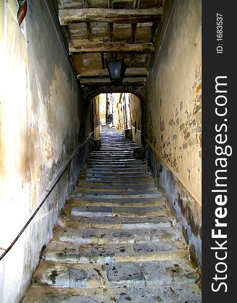 Little  covered street iwith stairs in Tuscany. Little  covered street iwith stairs in Tuscany