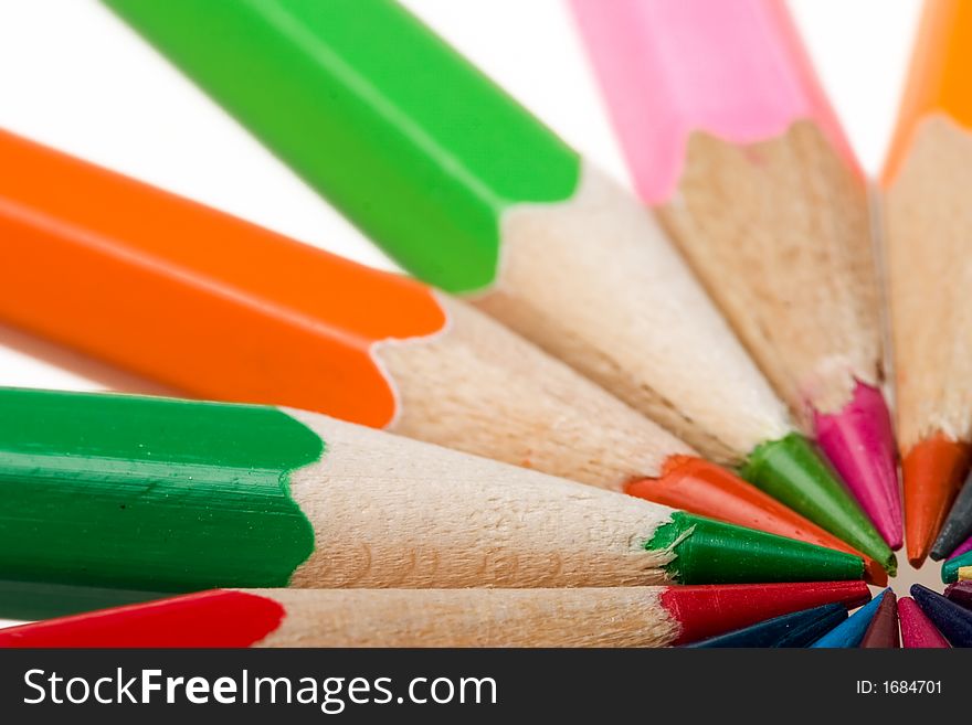 Thick colored pencils against a white background color