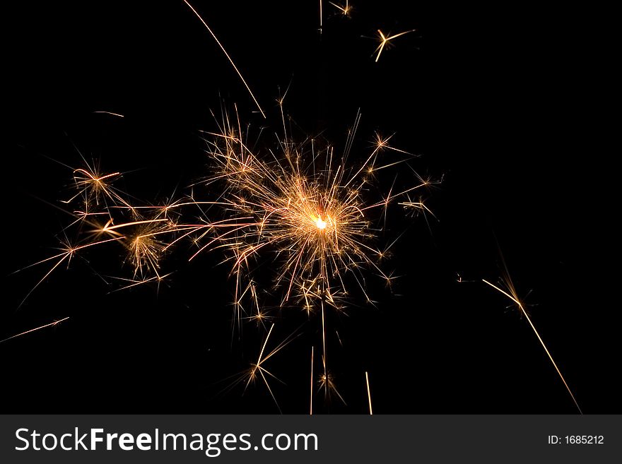 Detail view of a sparkler at night