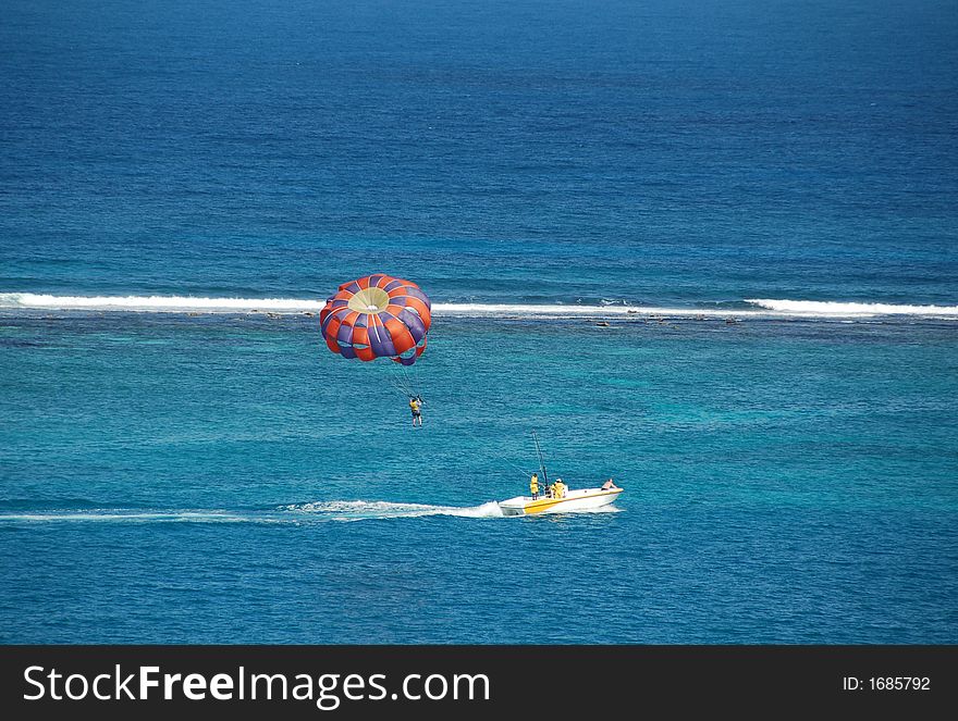 Parasailing activities at Caribbean island resort. Parasailing activities at Caribbean island resort
