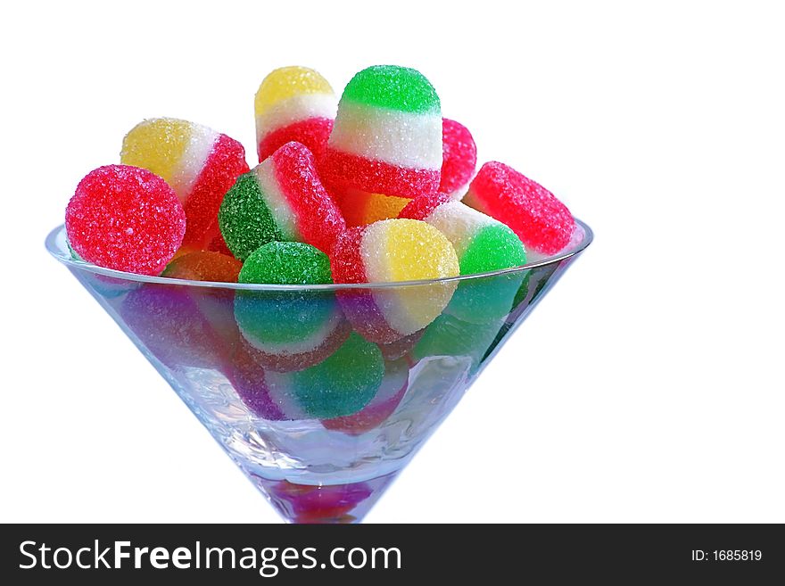 Candys in a blue glass against white background