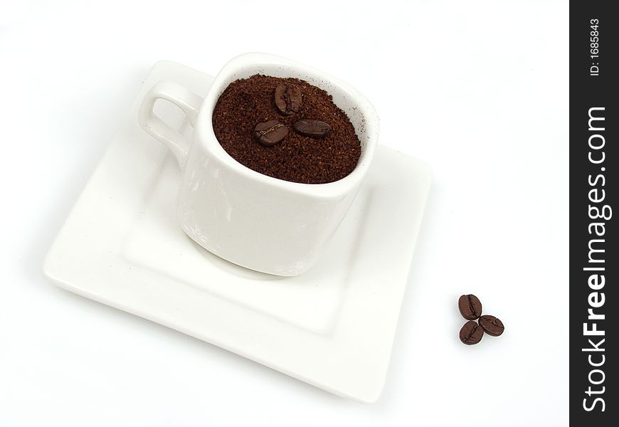 White coffe cup with black and brown beans. White coffe cup with black and brown beans