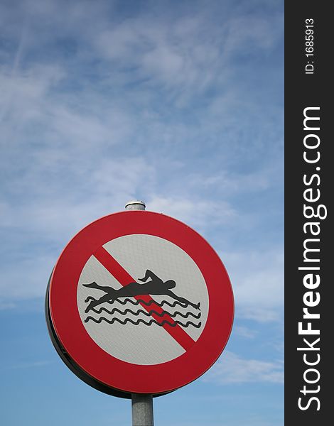 Prohibitory sign against blue sky