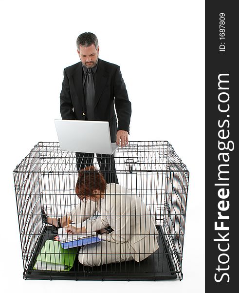 Thirty something business woman trapped in cage. Thirty something business woman trapped in cage.