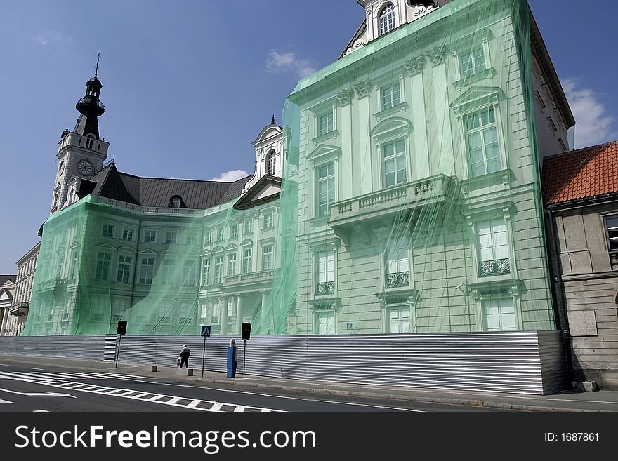 City hall in Warsaw covered with a green net during alterglobalists demonstration