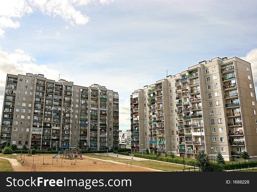 Architecture-dwelling-house,bloks of flats and  a playground in suburbs