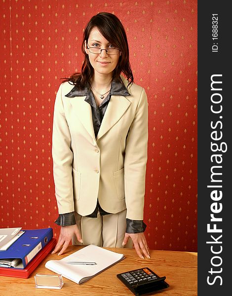 Young businesswoman doing some paperwork at her desk