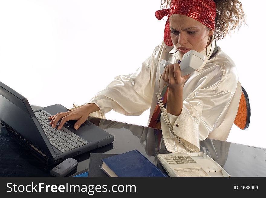 Young businesswoman talking  on phone in office. Young businesswoman talking  on phone in office