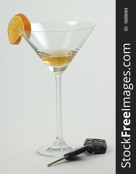 Set of car keys sitting beside an alcoholic drink. Set of car keys sitting beside an alcoholic drink.