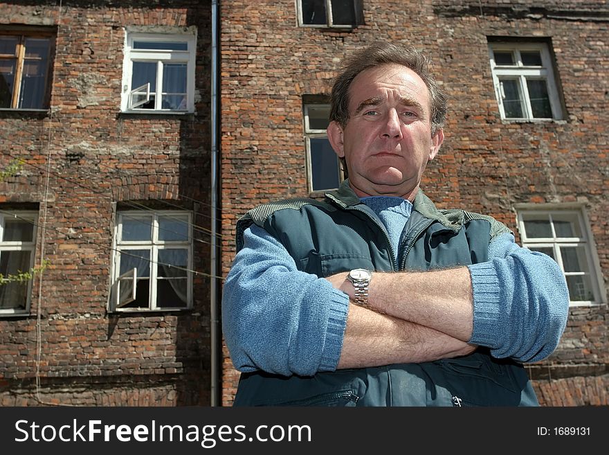 Man in front of  ruined tenement-house in Warsaw, Poland. Man in front of  ruined tenement-house in Warsaw, Poland