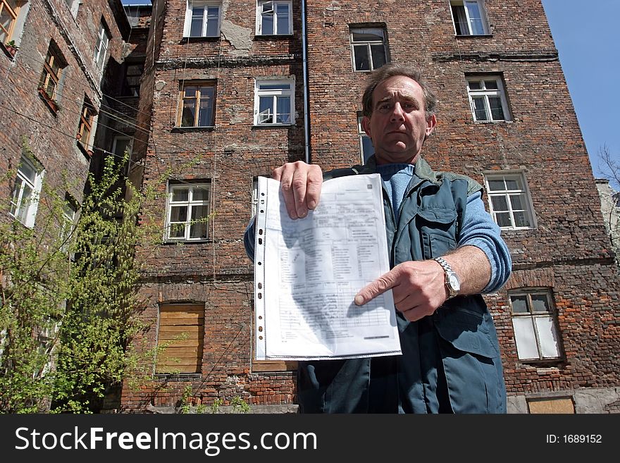 Man in front of ruined tenement-house in Warsaw, Poland. Man in front of ruined tenement-house in Warsaw, Poland