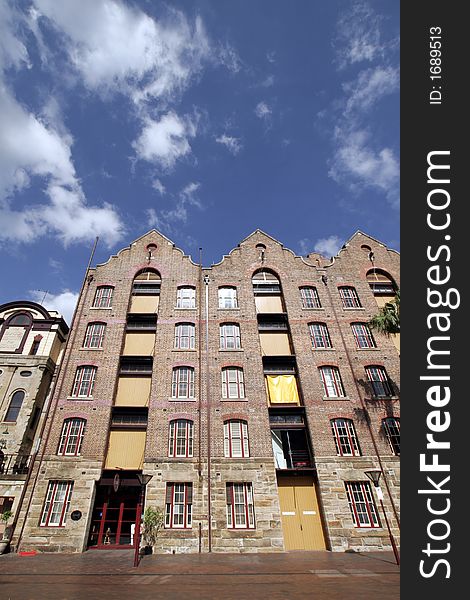 Apartment Building In Sydney, Australia - Blue Sky With Some Clouds, Wide-Angle Perspective. Apartment Building In Sydney, Australia - Blue Sky With Some Clouds, Wide-Angle Perspective