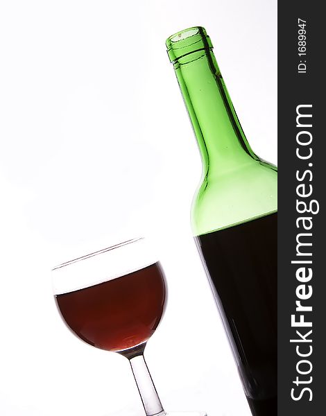 Red wine and bottle in wihte background.